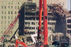 New York, Ground Zero 9/11/2001 
Aftermath of the attack on the World Trade Center. Workers searching the pile for survivors, Damaged Fire Trucks and Police vehicles