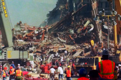 New York, Ground Zero 9/11/2001 
Aftermath of the attack on the World Trade Center. Workers searching the pile for survivors, Damaged Fire Trucks and Police vehicles