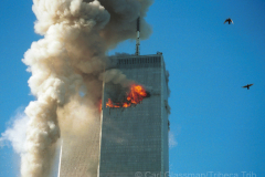 Flams and smoke shoot from North Tower seconds after it is struck.
