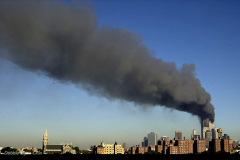 Photo Egan-Chin,Debbie
Twin towers burn after terrorist attack on Sept.11th. As seen from a rooftop in Brooklyn at 9:20AM , NY.