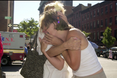 Debbie Egan-Chin photo                
Women embrace and wail as they watch the first World Trade Center tower collapse at 10:20AM on Sept. 11th.