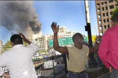 People react  in utter disbelief as the first twin tower collapses as viewed from the Hicks Street promenade in Brooklyn, NY.
Debbie Egan-Chin photo