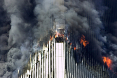 Smoke amd flames erupt from the World Trade Center - the aftermath of a terrorist attack. A hijacked American Airlines Boeing 767, originating from Boston's Logan Airport, struck 1 World Trade Center (north tower) at 8:45 a.m. At 9:03 a.m., a United Airlines 767, also hijacked in Boston, crashed into 2 World Trade Center (south tower). Both towers later collapsed.

twin towers smoke fire