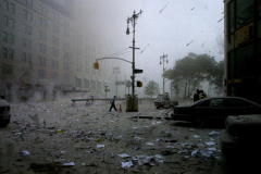 A man walks through what resembles a nuclear winter as the collapse of the World Trade Center sends a plume of debris and smoke torpedoing through the streets, covering lower Manhattan in a blanket of smoldering ash.