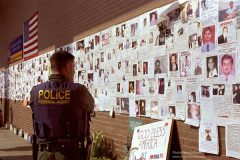 A ferderal agent strolls down memorial wall at St. Vincents Hospital in Manhattanon Monday sept,17th one week after the sept. 11th attack on the world treade center. (Photo/Suzi Altman)