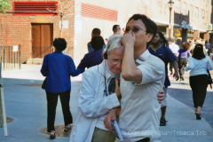 On Greenwich Street in Tribeca, a man and woman react to the site of the burning towers.