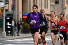New York City Marathon 21 ÒAbbott Dash to the FinishÓ 11/6/21.  A sea of runners take to the streets of Manhattan for the 5K race.  The race is the warmup event one day before the NYC Marathon.  Runners start at the United Nations and run to the Marathon finish line in Central Park. Here the runners run up 6th Avenue past the Radio City Music Hall.  Copyright Jon Simon