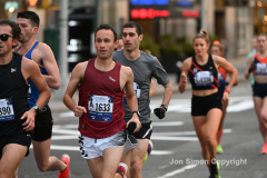 New York City Marathon 21 ÒAbbott Dash to the FinishÓ 11/6/21.  A sea of runners take to the streets of Manhattan for the 5K race.  The race is the warmup event one day before the NYC Marathon.  Runners start at the United Nations and run to the Marathon finish line in Central Park. Here the runners run up 6th Avenue past the Radio City Music Hall.  Copyright Jon Simon
