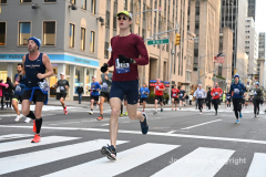 New York City Marathon 21 ÒAbbott Dash to the FinishÓ 11/6/21.  A sea of runners take to the streets of Manhattan for the 5K race.  The race is the warmup event one day before the NYC Marathon.  Runners start at the United Nations and run to the Marathon finish line in Central Park. Here the runners run up 6th Avenue past the Radio City Music Hall.  Copyright Jon Simon
