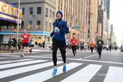 New York City Marathon 21 ÒAbbott Dash to the FinishÓ 11/6/21.  A sea of runners take to the streets of Manhattan for the 5K race.  The race is the warmup event one day before the NYC Marathon.  Runners start at the United Nations and run to the Marathon finish line in Central Park. Here the runners run up 6th Avenue past the Radio City Music Hall.  Copyright Jon Simon