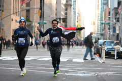 New York City Marathon 21 ÒAbbott Dash to the FinishÓ 11/6/21.  A sea of runners take to the streets of Manhattan for the 5K race.  The race is the warmup event one day before the NYC Marathon.  Runners start at the United Nations and run to the Marathon finish line in Central Park. Here the runners run up 6th Avenue past the Radio City Music Hall.  Copyright Jon Simon