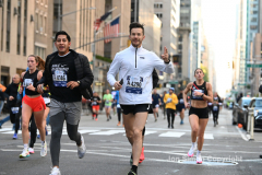 New York City Marathon 21 ÒAbbott Dash to the FinishÓ 11/6/21.  A sea of runners take to the streets of Manhattan for the 5K race.  The race is the warmup event one day before the NYC Marathon.  Runners start at the United Nations and run to the Marathon finish line in Central Park. Here the runners run up 6th Avenue past the Radio City Music Hall.  Copyright Jon Simon