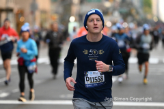 New York City Marathon 21 ÒAbbott Dash to the FinishÓ 11/6/21.  A sea of runners take to the streets of Manhattan for the 5K race.  The race is the warmup event one day before the NYC Marathon.  Runners start at the United Nations and run to the Marathon finish line in Central Park. Here the runners run up 6th Avenue past the Radio City Music Hall.  Copyright Jon Simon