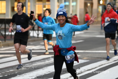 New York City Marathon 21 ÒAbbott Dash to the FinishÓ 11/6/21.  A sea of runners take to the streets of Manhattan for the 5K race.  The race is the warmup event one day before the NYC Marathon.  Runners start at the United Nations and run to the Marathon finish line in Central Park. Here the runners run up 6th Avenue past the Radio City Music Hall.  Copyright Jon Simon