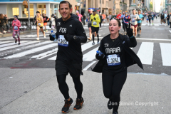 New York City Marathon 21 ÒAbbott Dash to the FinishÓ 11/6/21.  A sea of runners take to the streets of Manhattan for the 5K race.  The race is the warmup event one day before the NYC Marathon.  Runners start at the United Nations and run to the Marathon finish line in Central Park. Here the runners run up 6th Avenue past the Radio City Music Hall.  Copyright Jon Simon