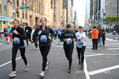 New York City Marathon 21 ÒAbbott Dash to the FinishÓ 11/6/21.  A sea of runners take to the streets of Manhattan for the 5K race.  The race is the warmup event one day before the NYC Marathon.  Runners start at the United Nations and run to the Marathon finish line in Central Park. Here the runners run up 6th Avenue past the Radio City Music Hall.  Copyright Jon Simon