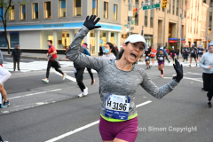 New York City Marathon 21 ÒAbbott Dash to the FinishÓ 11/6/21.  A sea of runners take to the streets of Manhattan for the 5K race.  The race is the warmup event one day before the NYC Marathon.  Runners start at the United Nations and run to the Marathon finish line in Central Park. Here the runners run up 6th Avenue past the Radio City Music Hall.  Copyright Jon Simon