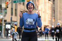 New York City Marathon 21 ÒAbbott Dash to the FinishÓ 11/6/21.  A sea of runners take to the streets of Manhattan for the 5K race.  The race is the warmup event one day before the NYC Marathon.  Runners start at the United Nations and run to the Marathon finish line in Central Park. Here the runners run up 6th Avenue past the Radio City Music Hall.  Copyright Jon Simon