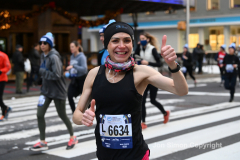 New York City Marathon 21 ÒAbbott Dash to the FinishÓ 11/6/21.  A sea of runners take to the streets of Manhattan for the 5K race.  The race is the warmup event one day before the NYC Marathon.  Runners start at the United Nations and run to the Marathon finish line in Central Park. Here the runners run up 6th Avenue past the Radio City Music Hall.  Copyright Jon Simon