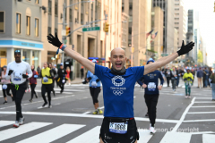 New York City Marathon 21 ÒAbbott Dash to the FinishÓ 11/6/21.  A sea of runners take to the streets of Manhattan for the 5K race.  The race is the warmup event one day before the NYC Marathon.  Runners start at the United Nations and run to the Marathon finish line in Central Park. Here the runners run up 6th Avenue past the Radio City Music Hall.  Copyright Jon Simon