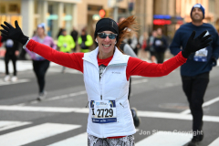 New York City Marathon 21 ÒAbbott Dash to the FinishÓ 11/6/21.  A sea of runners take to the streets of Manhattan for the 5K race.  The race is the warmup event one day before the NYC Marathon.  Runners start at the United Nations and run to the Marathon finish line in Central Park. Here the runners run up 6th Avenue past the Radio City Music Hall.  Copyright Jon Simon