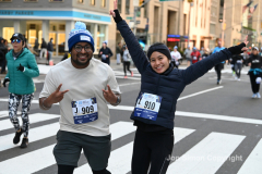New York City Marathon 21 ÒAbbott Dash to the FinishÓ 11/6/21.  A sea of runners take to the streets of Manhattan for the 5K race.  The race is the warmup event one day before the NYC Marathon.  Runners start at the United Nations and run to the Marathon finish line in Central Park. Here the runners run up 6th Avenue past the Radio City Music Hall.  Copyright Jon Simon