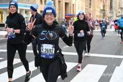 New York City Marathon 21 ÒAbbott Dash to the FinishÓ 11/6/21.  A sea of runners take to the streets of Manhattan for the 5K race.  The race is the warmup event one day before the NYC Marathon.  Runners start at the United Nations and run to the Marathon finish line in Central Park. Here the runners run up 6th Avenue past the Radio City Music Hall.  Copyright Jon Simon