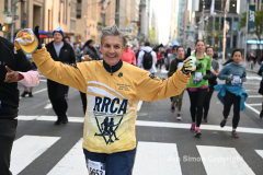 New York City Marathon 21 ÒAbbott Dash to the FinishÓ 11/6/21.  A sea of runners take to the streets of Manhattan for the 5K race.  The race is the warmup event one day before the NYC Marathon.  Runners start at the United Nations and run to the Marathon finish line in Central Park. Here the runners run up 6th Avenue past the Radio City Music Hall.  Copyright Jon Simon