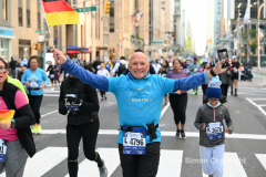 New York City Marathon 21 ÒAbbott Dash to the FinishÓ 11/6/21.  A sea of runners take to the streets of Manhattan for the 5K race.  The race is the warmup event one day before the NYC Marathon.  Runners start at the United Nations and run to the Marathon finish line in Central Park. Here the runners run up 6th Avenue past the Radio City Music Hall.  Copyright Jon Simon