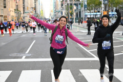New York City Marathon 21 ÒAbbott Dash to the FinishÓ 11/6/21.  A sea of runners take to the streets of Manhattan for the 5K race.  The race is the warmup event one day before the NYC Marathon.  Runners start at the United Nations and run to the Marathon finish line in Central Park. Here the runners run up 6th Avenue past the Radio City Music Hall.  Copyright Jon Simon