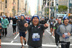 New York City Marathon 21 ÒAbbott Dash to the FinishÓ 11/6/21.  A sea of runners take to the streets of Manhattan for the 5K race.  The race is the warmup event one day before the NYC Marathon.  Runners start at the United Nations and run to the Marathon finish line in Central Park. Here the runners run up 6th Avenue past the Radio City Music Hall.  Copyright Jon Simon