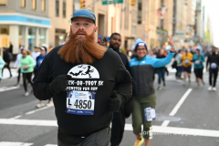 New York City Marathon 21 ÒAbbott Dash to the FinishÓ 11/6/21.  A sea of runners take to the streets of Manhattan for the 5K race.  The race is the warmup event one day before the NYC Marathon.  Runners start at the United Nations and run to the Marathon finish line in Central Park. Here the runners run up 6th Avenue past the Radio City Music Hall.  Copyright Jon Simon