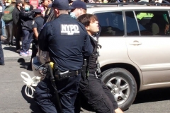 Abolish I.C.E. protest at Duffy Square in Times Square N.Y.C. Protestors blocked the streets with bicycles and made a human wall with them interlocking arms to deny vehicle traffic to move along Broadway. N.Y.P.D moved in quickly and arrested the protestors about 100 of them were handcuffed and taken into custody.