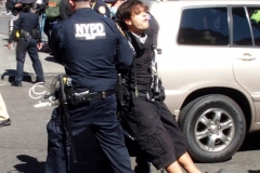 Abolish I.C.E. protest at Duffy Square in Times Square N.Y.C. Protestors blocked the streets with bicycles and made a human wall with them interlocking arms to deny vehicle traffic to move along Broadway. N.Y.P.D moved in quickly and arrested the protestors about 100 of them were handcuffed and taken into custody.