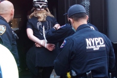 Abolish I.C.E. protest at Duffy Square in Times Square N.Y.C. Protestors blocked the streets with bicycles and made a human wall with them interlocking arms to deny vehicle traffic to move along Broadway. N.Y.P.D moved in quickly and arrested the protestors about 100 of them were handcuffed and taken into custody.