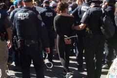 Abolish I.C.E. protest at Duffy Square in Times Square N.Y.C. Protestors blocked the streets with bicycles and made a human wall with them interlocking arms to deny vehicle traffic to move along Broadway. N.Y.P.D moved in quickly and arrested the protestors about 100 of them were handcuffed and taken into custody.