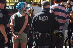 Abolish I.C.E. protest at Duffy Square in Times Square N.Y.C. Protestors blocked the streets with bicycles and made a human wall with them interlocking arms to deny vehicle traffic to move along Broadway. N.Y.P.D moved in quickly and arrested the protestors about 100 of them were handcuffed and taken into custody.