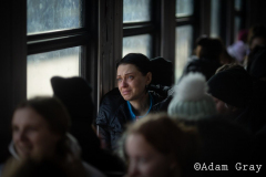 ‘I am a refugee now’, a woman said to me smiling by the side of the track. After covering the Ukrainian exodus into Poland for two weeks I crossed the border with my friend/colleague @tnicholsonphoto , to be able to set eyes on their country from which they are being forced to flee, to try and understand more (if only by a limited amount) about the situation and to ride the same train out that they rode. The train from Lviv was largely full of women and children with the odd man. Everybody made last minute calls. The train stopped for hours in the middle of nowhere. Kids ran around and played on Ukrainian soil, maybe for the last time. Mothers, wives and daughters told me about their previous lives and the men they had left behind. People hugged, cried and kissed. They looked out of train windows at beautiful orthodox churches as a big orange sun set over their land