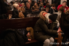 ‘I am a refugee now’, a woman said to me smiling by the side of the track. After covering the Ukrainian exodus into Poland for two weeks I crossed the border with my friend/colleague @tnicholsonphoto , to be able to set eyes on their country from which they are being forced to flee, to try and understand more (if only by a limited amount) about the situation and to ride the same train out that they rode. The train from Lviv was largely full of women and children with the odd man. Everybody made last minute calls. The train stopped for hours in the middle of nowhere. Kids ran around and played on Ukrainian soil, maybe for the last time. Mothers, wives and daughters told me about their previous lives and the men they had left behind. People hugged, cried and kissed. They looked out of train windows at beautiful orthodox churches as a big orange sun set over their land