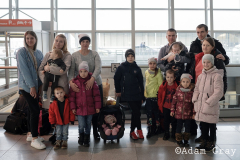 Oleg (Far right) and his mother Valentina (center left with hat), and all of the other children and grandchildren are from Poltova. They were flying to Frankfurt, Germany.