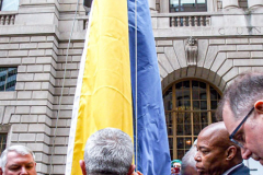 NYC Mayor ERIC ADAMS spoke to the public and raised both the American and Ukrainian flags together to show solidarity with Ukraine and to commemorate a month since the unprovoked attack made by Russia on the Ukraine in Bowling Green, Downtown Manhattan.
Key Ukrainian representatives as well as local politicians came to show support as well as members of  LGBTQ, RAZOM and Americans for Ukraine amongst others.  Bowling Green, Manhattan, NYC. Wednesday, March 23, 2022. (C) Bianca Otero