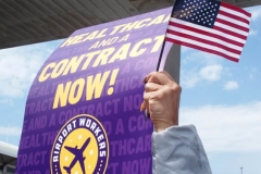NEW YORK - Airport workers rally for fair contract. 10,000 workers at the 3 major airports in the New York Tri-State area hold signs and demand a fair contract including health benefits.Over 250 members of 32Bj union hold signs and chant in front of terminal 5 at John F. Kennedy airport some elected officials speak to the protestors.