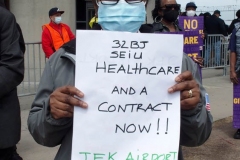 NEW YORK - Airport workers rally for fair contract. 10,000 workers at the 3 major airports in the New York Tri-State area hold signs and demand a fair contract including health benefits.Over 250 members of 32Bj union hold signs and chant in front of terminal 5 at John F. Kennedy airport some elected officials speak to the protestors.