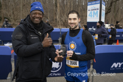 February 26, 2022: The Al Gordon 4 Mile race is held in Prospect Park, Brooklyn, honoring Al Gordon and his lifelong commitment to running.  Zackary Harris recieves the 1st Place award in the Non-Binary division from Race director Ted Metellus. Copyright Jon Simon