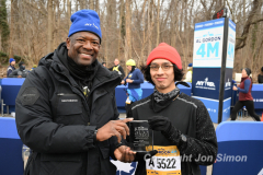 February 26, 2022: The Al Gordon 4 Mile race is held in Prospect Park, Brooklyn, honoring Al Gordon and his lifelong commitment to running. Galo Vasquez recieves his 1st place award for the men's division from Race Directorn Ted Metellus. Copyright Jon Simon