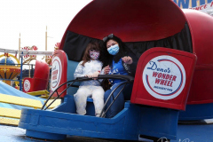 People enjoying the reopening of the Coney Island amusement area in New York.