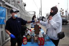 A worker makes an egg cream at the reopening of the Coney Island amusement area in New York.
