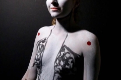 Andy Golub  Artist paints models for a living mural in his art space.