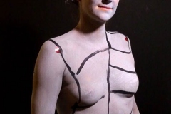 Andy Golub  Artist paints models for a living mural in his art space.