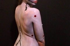 Andy Golub  Artist paints models for a living mural in his art space.